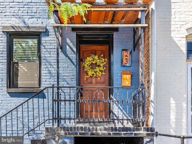 23 W 5th St, Frederick, MD 21701 - doorway to property with brick siding
