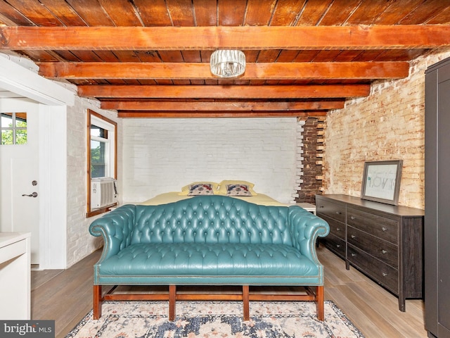 23 W 5th St, Frederick, MD 21701 - living area featuring a wooden ceiling with exposed beams, wood finished floors, brick wall, and cooling unit