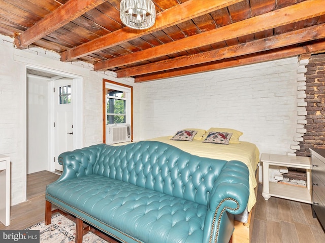 23 W 5th St, Frederick, MD 21701 - bedroom with wood finished floors, a wooden ceiling with exposed beams, and brick wall
