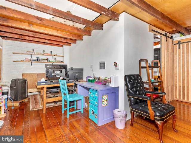 23 W 5th St, Frederick, MD 21701 - office featuring beamed ceiling, a barn door, and hardwood / wood-style flooring