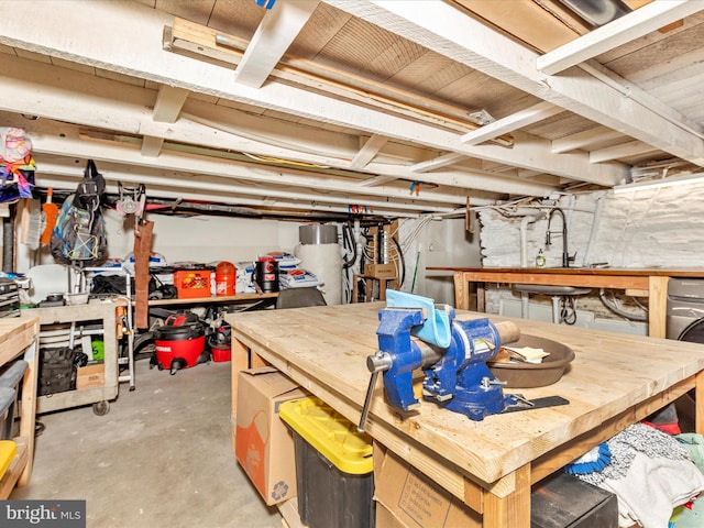 23 W 5th St, Frederick, MD 21701 - unfinished basement featuring a workshop area and gas water heater