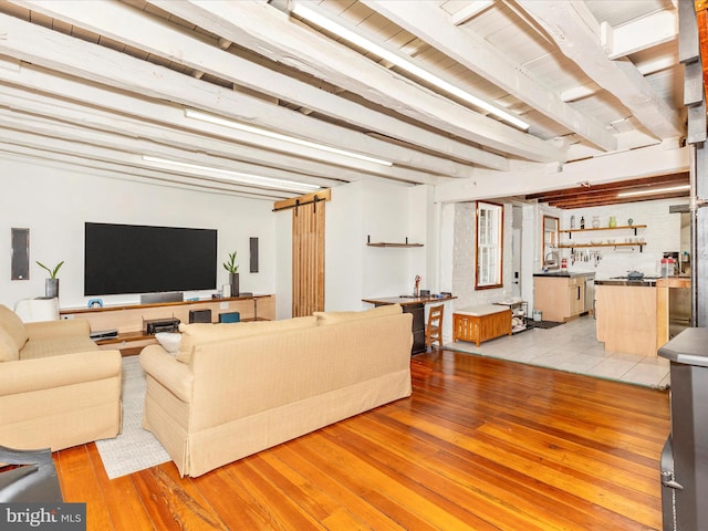 23 W 5th St, Frederick, MD 21701 - living area with light wood-style flooring and beam ceiling
