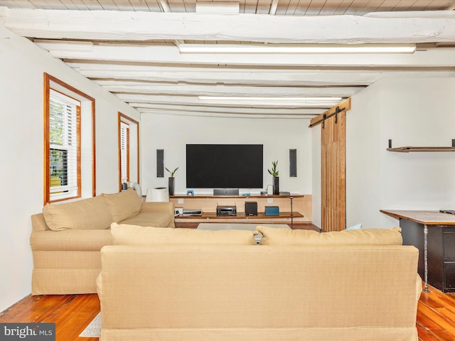 23 W 5th St, Frederick, MD 21701 - living area with a barn door, wood finished floors, and beamed ceiling