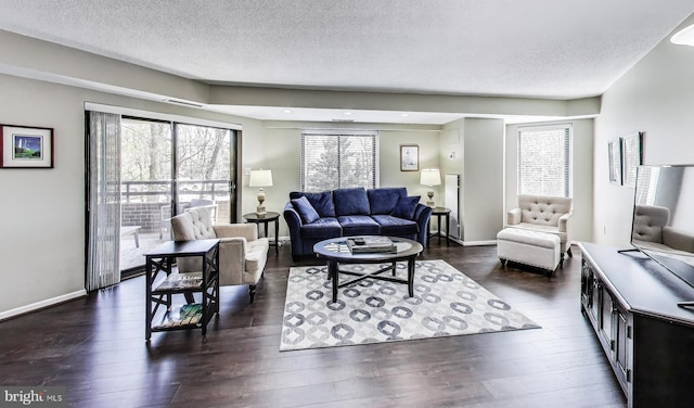 2111 Wisconsin Ave NW Unit 109, Washington, DC 20007 - living room featuring a textured ceiling and dark wood-style flooring