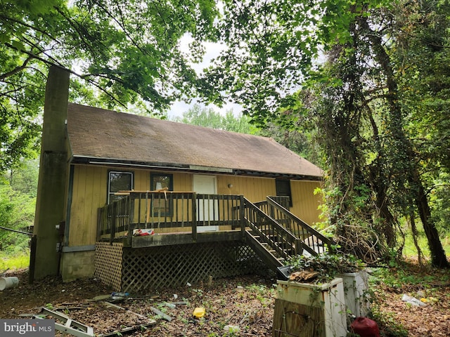 102 Deer Run Rd, Townsend, DE 19734 - rear view of house with a wooden deck and a shingled roof