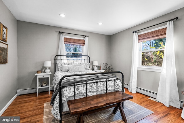 69 Plymouth Rd, Sicklerville, NJ 08081 - bedroom with a baseboard heating unit, wood finished floors, and recessed lighting
