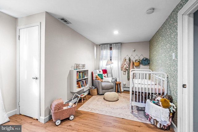 69 Plymouth Rd, Sicklerville, NJ 08081 - bedroom featuring wood finished floors, a crib, and recessed lighting