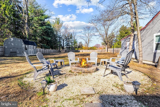 69 Plymouth Rd, Sicklerville, NJ 08081 - fenced backyard with an outdoor fire pit and a storage unit