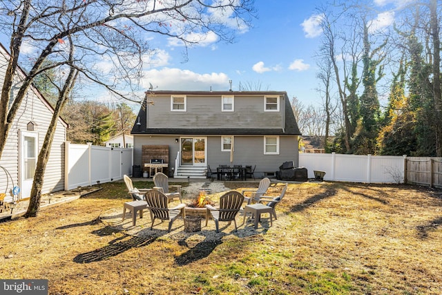 69 Plymouth Rd, Sicklerville, NJ 08081 - back of property with an outdoor fire pit, a fenced backyard, and a patio area