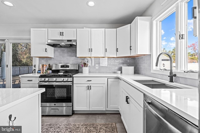 69 Plymouth Rd, Sicklerville, NJ 08081 - kitchen with appliances with stainless steel finishes, under cabinet range hood, recessed lighting, white cabinetry, and light countertops
