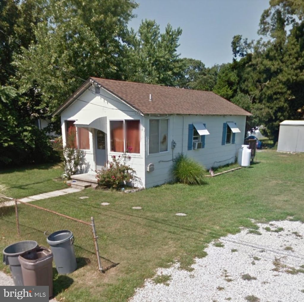211 W Atlantic Ave, Villas, NJ 08251 - view of front of home featuring a front yard and a shingled roof
