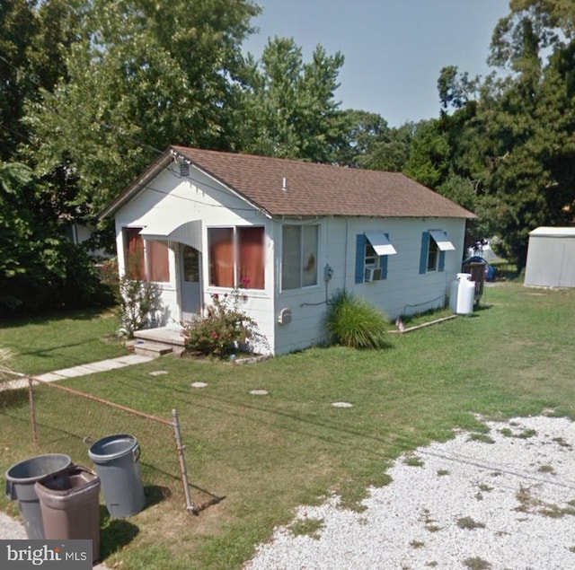 211 W Atlantic Ave, Villas, NJ 08251 - view of front of home featuring a front yard and a shingled roof