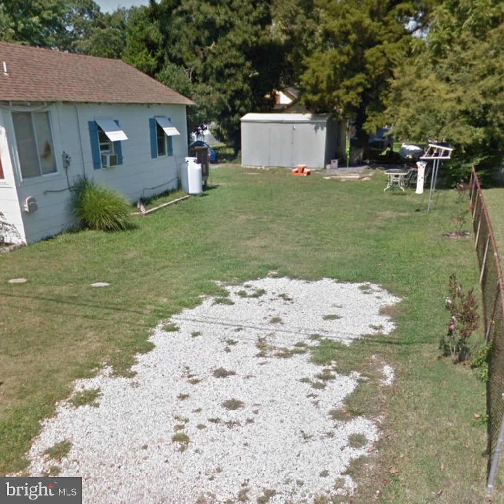 211 W Atlantic Ave, Villas, NJ 08251 - view of green lawn featuring an outbuilding