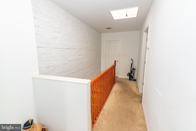 16 S Kresson St, Baltimore, MD 21224 - hall featuring an upstairs landing, light carpet, and brick wall
