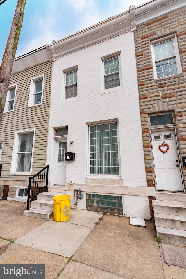 16 S Kresson St, Baltimore, MD 21224 - view of property featuring entry steps, stone siding, and brick siding