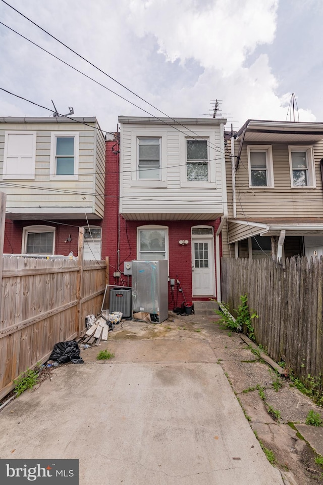 16 S Kresson St, Baltimore, MD 21224 - rear view of property featuring a fenced backyard and a patio