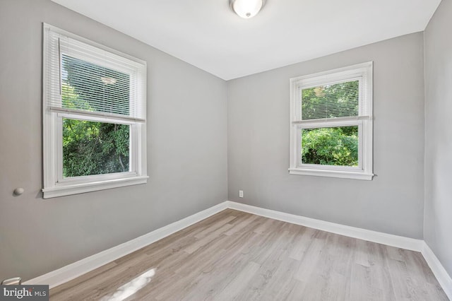 1112 Gleneagle Rd, Baltimore, MD 21239 - empty room with wood finished floors and baseboards