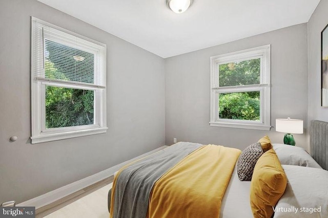 1112 Gleneagle Rd, Baltimore, MD 21239 - bedroom with baseboards and wood finished floors