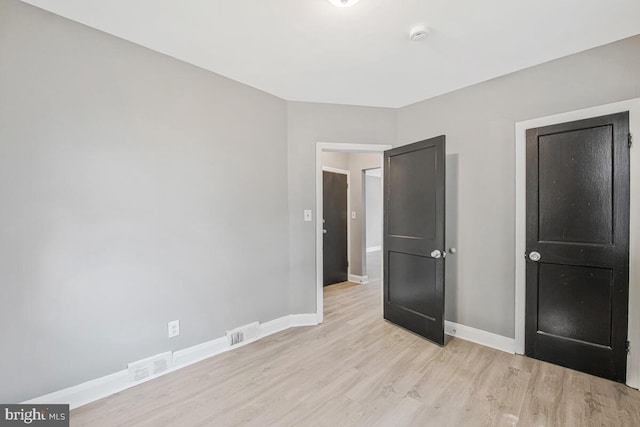 1112 Gleneagle Rd, Baltimore, MD 21239 - unfurnished bedroom with light wood-style floors and baseboards