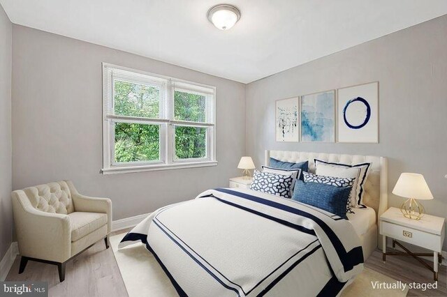 1112 Gleneagle Rd, Baltimore, MD 21239 - bedroom with wood finished floors and baseboards