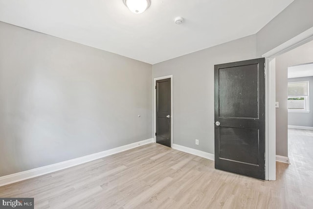 1112 Gleneagle Rd, Baltimore, MD 21239 - unfurnished bedroom featuring wood finished floors and baseboards