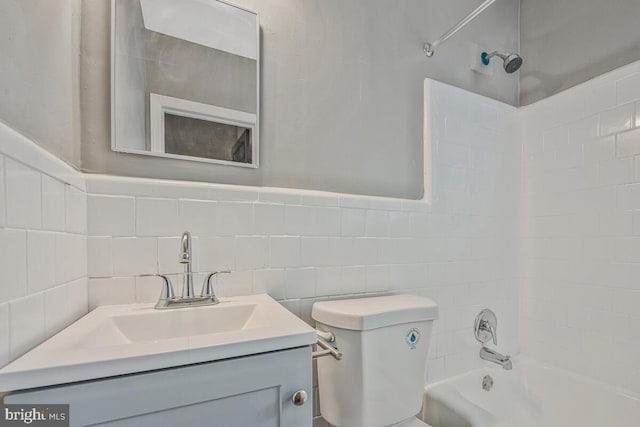 1112 Gleneagle Rd, Baltimore, MD 21239 - full bath with shower / bathtub combination, vanity, and tile walls
