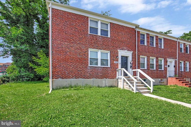 1112 Gleneagle Rd, Baltimore, MD 21239 - multi unit property featuring a front yard and brick siding
