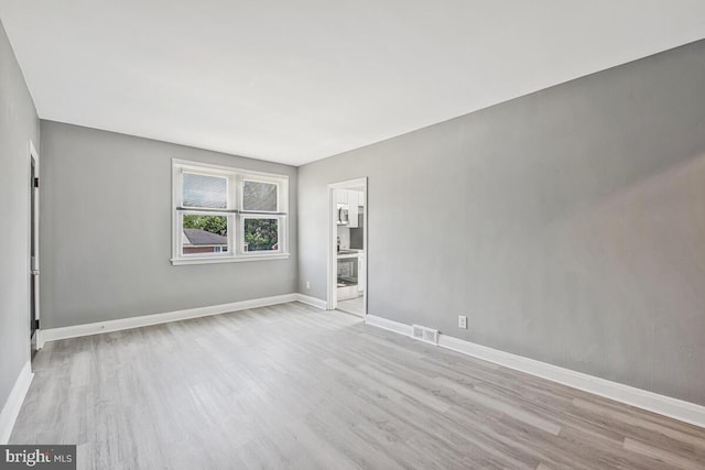 1112 Gleneagle Rd, Baltimore, MD 21239 - unfurnished room with wood finished floors and baseboards