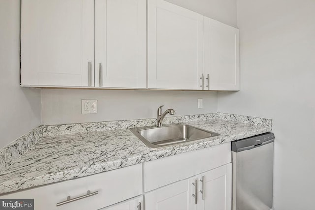1112 Gleneagle Rd, Baltimore, MD 21239 - kitchen with stainless steel dishwasher and white cabinetry