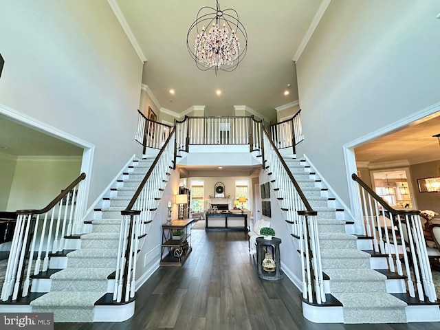 306 Rowland Ln, Line Lexington, PA 18932 - stairway featuring a chandelier, a high ceiling, plenty of natural light, crown molding, and recessed lighting