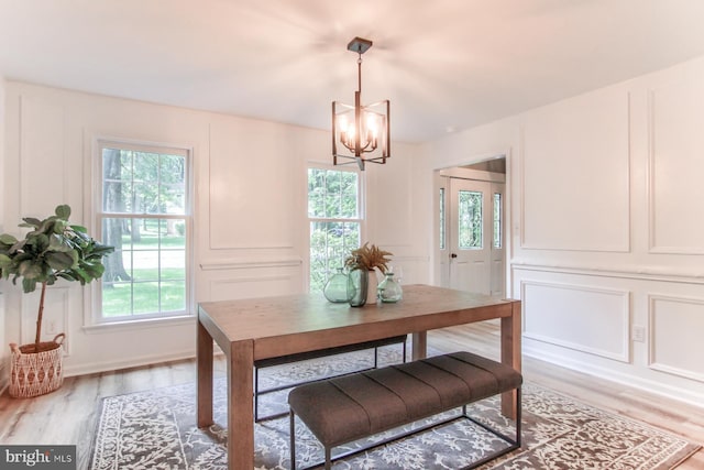 128 Azalea Dr, Hershey, PA 17033 - dining area featuring a decorative wall, a chandelier, plenty of natural light, and light wood-style flooring