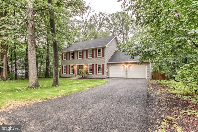 128 Azalea Dr, Hershey, PA 17033 - colonial-style house featuring a garage, asphalt driveway, and roof with shingles