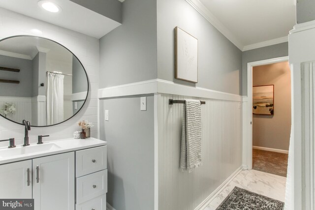 128 Azalea Dr, Hershey, PA 17033 - bathroom featuring marble finish floors, crown molding, vanity, and a wainscoted wall