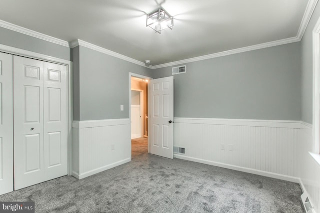128 Azalea Dr, Hershey, PA 17033 - unfurnished bedroom featuring wainscoting, carpet, crown molding, and a closet