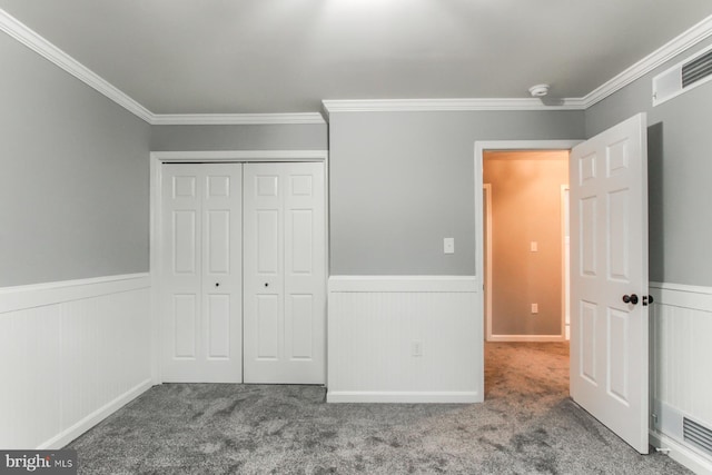 128 Azalea Dr, Hershey, PA 17033 - unfurnished bedroom featuring a wainscoted wall, crown molding, carpet, and a closet
