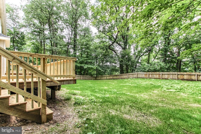 128 Azalea Dr, Hershey, PA 17033 - fenced backyard with a deck and view of wooded area