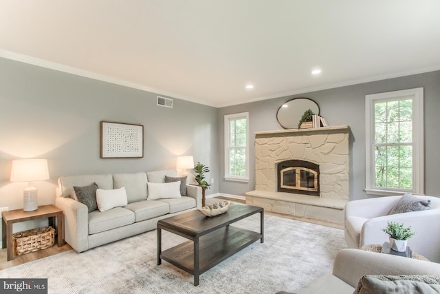 128 Azalea Dr, Hershey, PA 17033 - living area with crown molding, wood finished floors, healthy amount of natural light, a fireplace, and recessed lighting