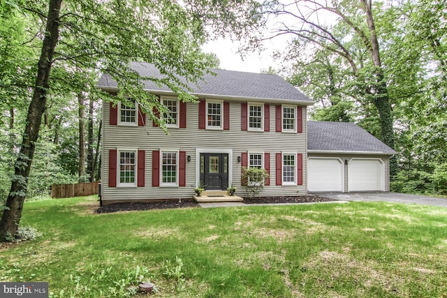 128 Azalea Dr, Hershey, PA 17033 - colonial home featuring a garage, asphalt driveway, and a shingled roof