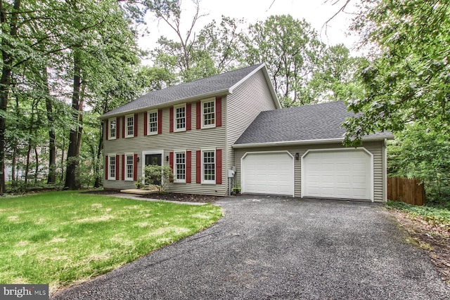 128 Azalea Dr, Hershey, PA 17033 - colonial inspired home featuring a garage, driveway, and a shingled roof