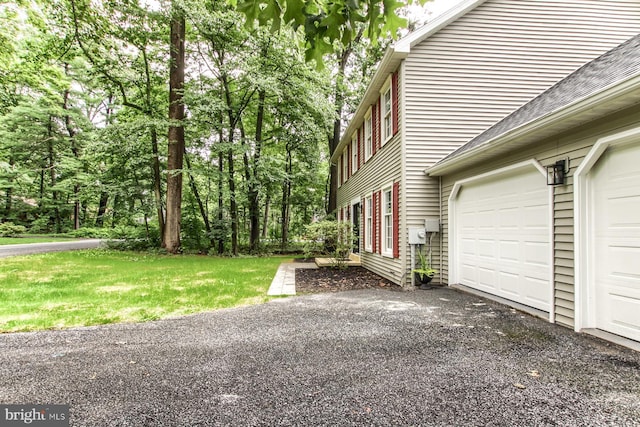 128 Azalea Dr, Hershey, PA 17033 - view of side of property featuring driveway, a shingled roof, and a lawn