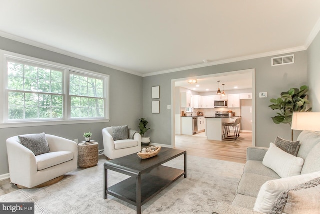 128 Azalea Dr, Hershey, PA 17033 - living room with ornamental molding and light wood-type flooring