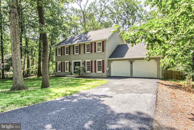 128 Azalea Dr, Hershey, PA 17033 - colonial house featuring an attached garage, asphalt driveway, and roof with shingles