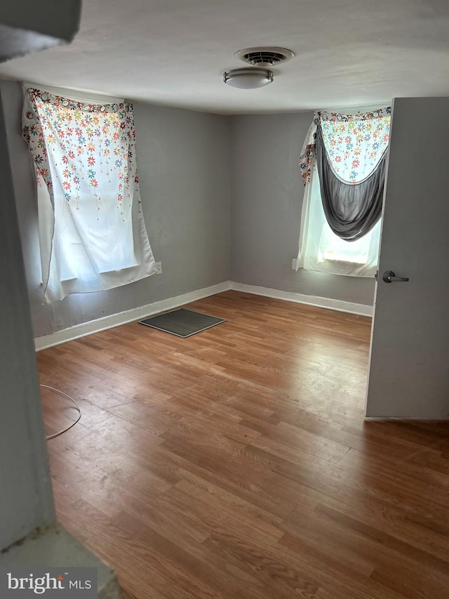 723 N Broad St, Woodbury, NJ 08096 - empty room with wood finished floors and baseboards