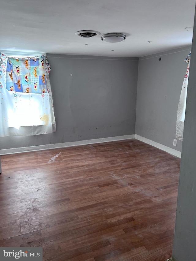 723 N Broad St, Woodbury, NJ 08096 - spare room with wood finished floors and baseboards