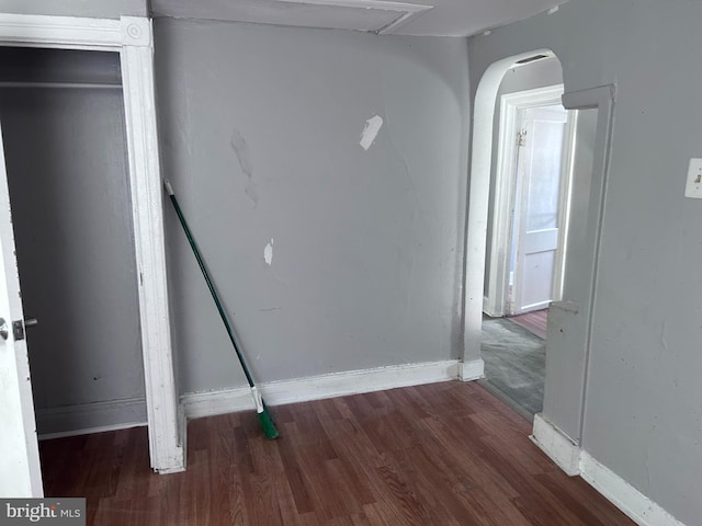 723 N Broad St, Woodbury, NJ 08096 - unfurnished bedroom featuring wood finished floors and arched walkways