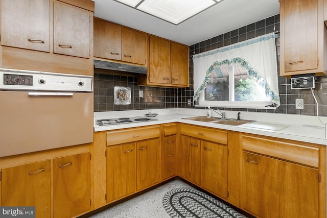 1402 Lehigh St, Allentown, PA 18103 - kitchen featuring oven, electric stovetop, light countertops, tasteful backsplash, and brown cabinets