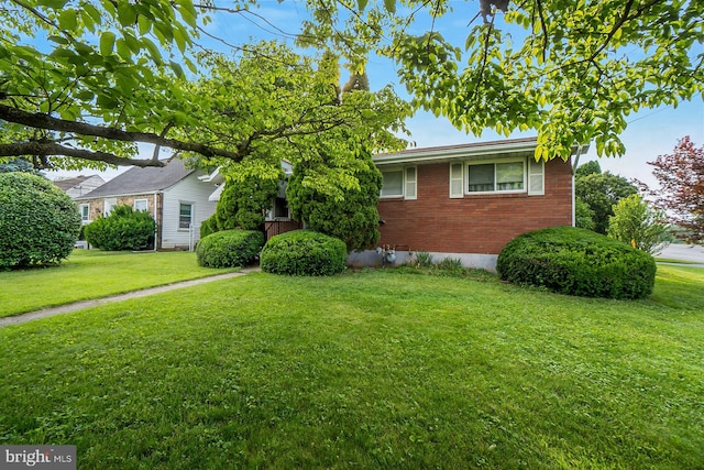 1402 Lehigh St, Allentown, PA 18103 - view of front of house with brick siding and a front yard