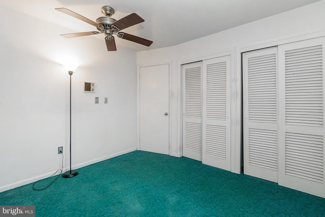 1402 Lehigh St, Allentown, PA 18103 - unfurnished bedroom featuring dark colored carpet, a ceiling fan, and two closets