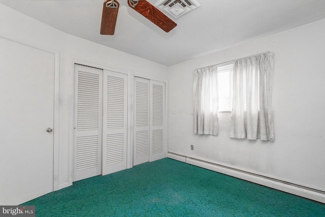 1402 Lehigh St, Allentown, PA 18103 - unfurnished bedroom with baseboard heating, a ceiling fan, carpet floors, and multiple closets