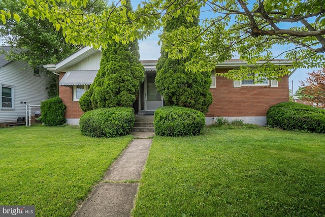 1402 Lehigh St, Allentown, PA 18103 - view of front of house featuring brick siding and a front lawn